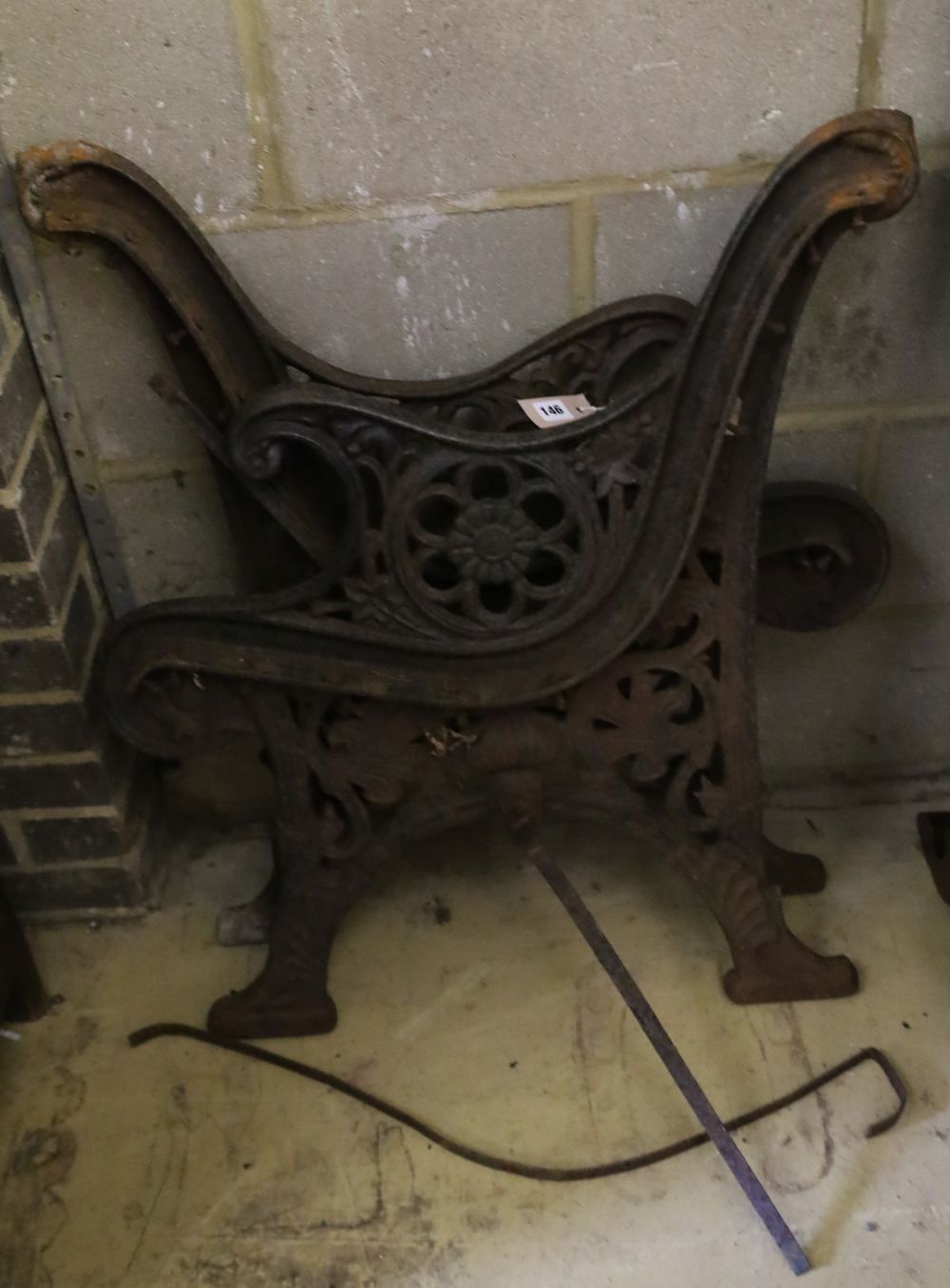 A pair of Victorian Coalbrookdale style cast iron bench ends